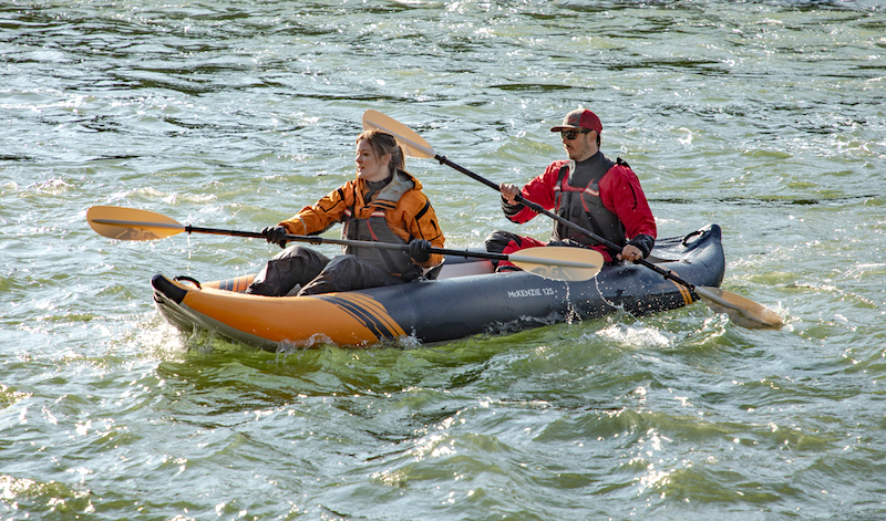 paddling the Aquaglide MacKenzie 125 inflatable kayak with two people